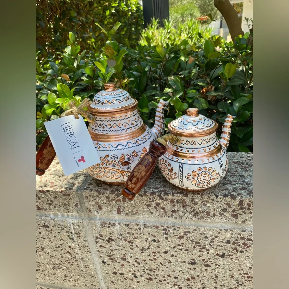 This handmade, white-painted Turkish copper teapot set features traditional